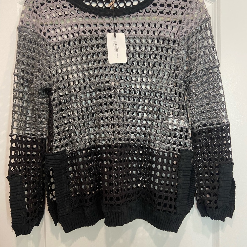 New tags on Pete Collection crochet sweater